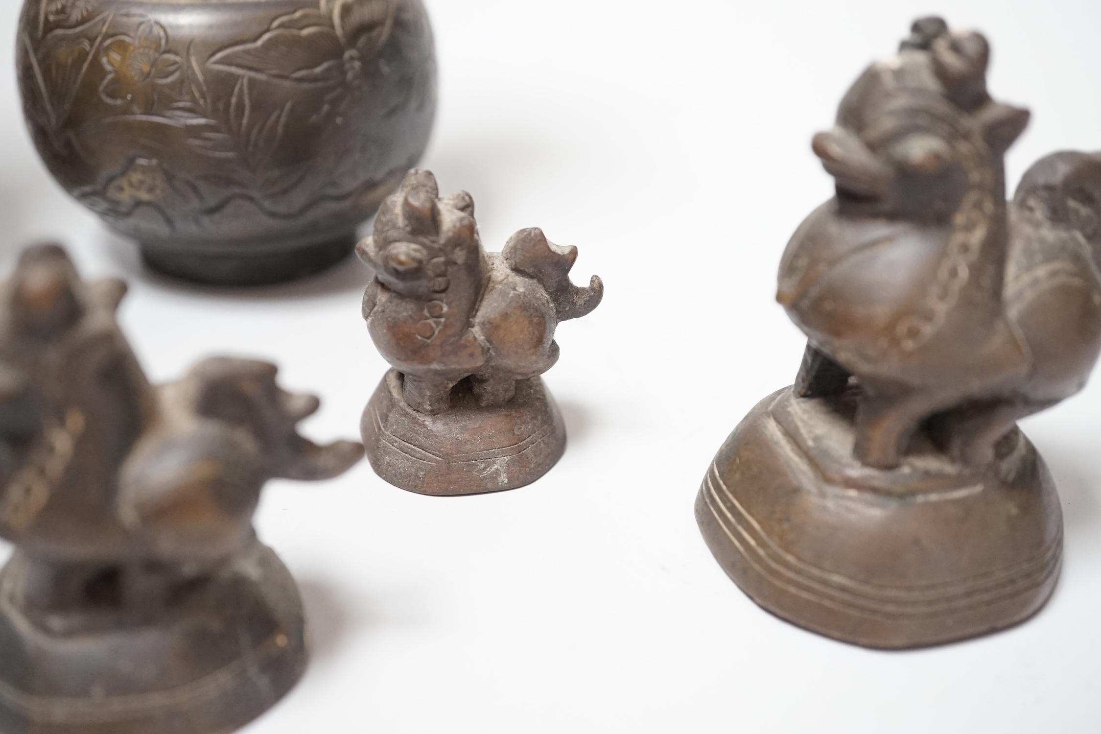 A set of Burmese bronze weights and a pair of bronze vases, 12cm